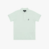 A light mint green polo shirt for kids, featuring a small embroidered logo on the left chest and a black brand label on the collar