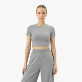Woman wearing a gray athletic outfit with 'James Bark' branding on a white background