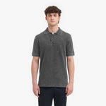 Man wearing a gray polo shirt on a white background