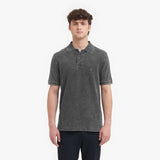 Man wearing a gray polo shirt on a white background