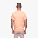 Man wearing a beige t-shirt on a white background