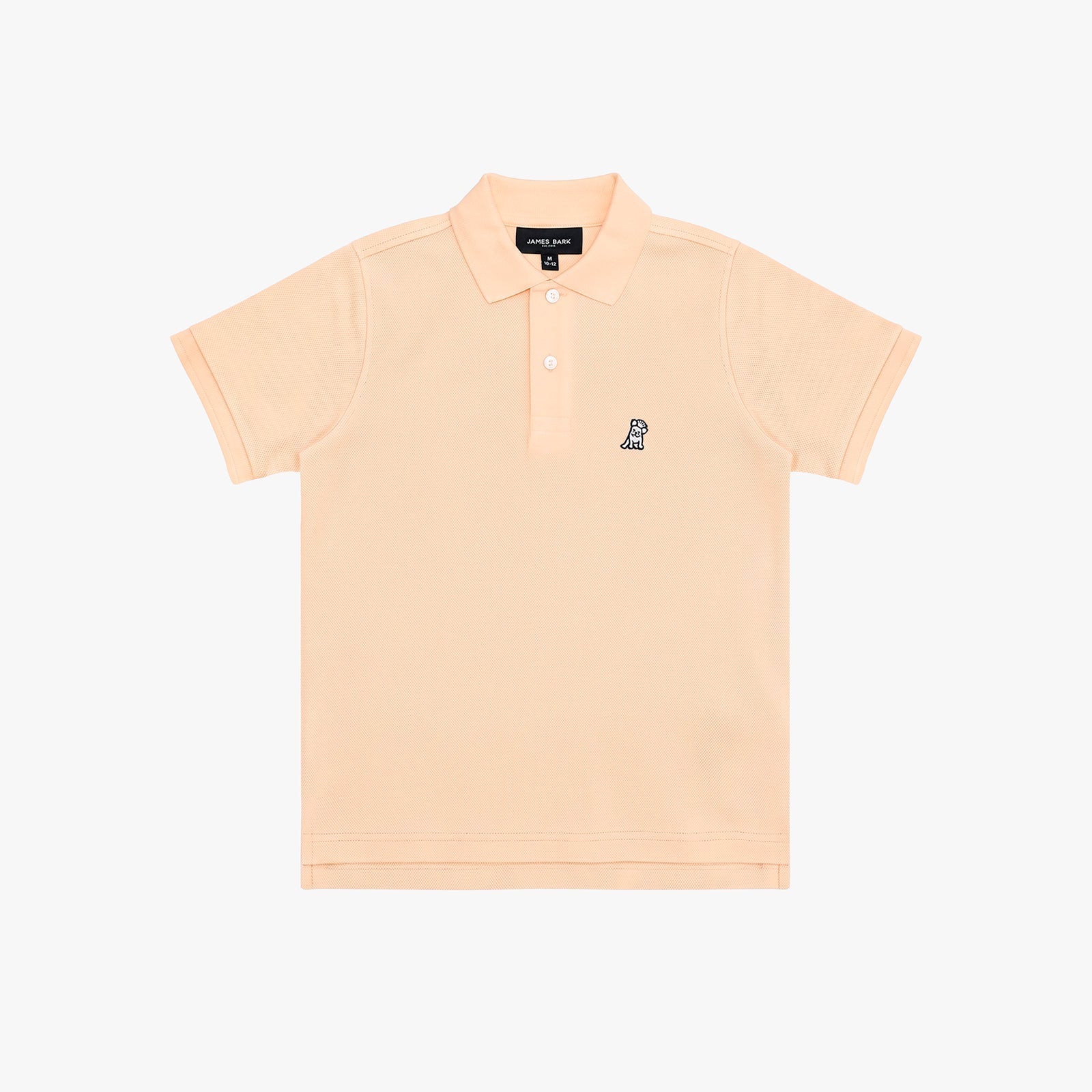 A light peach-pink polo shirt for kids, featuring a small navy embroidered dog logo on the left chest, set against a plain white background.