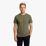 Man wearing an olive green t-shirt on a white background