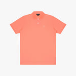 Coral polo shirt on a light gray background