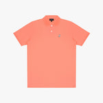 Coral polo shirt with a small logo on a light gray background