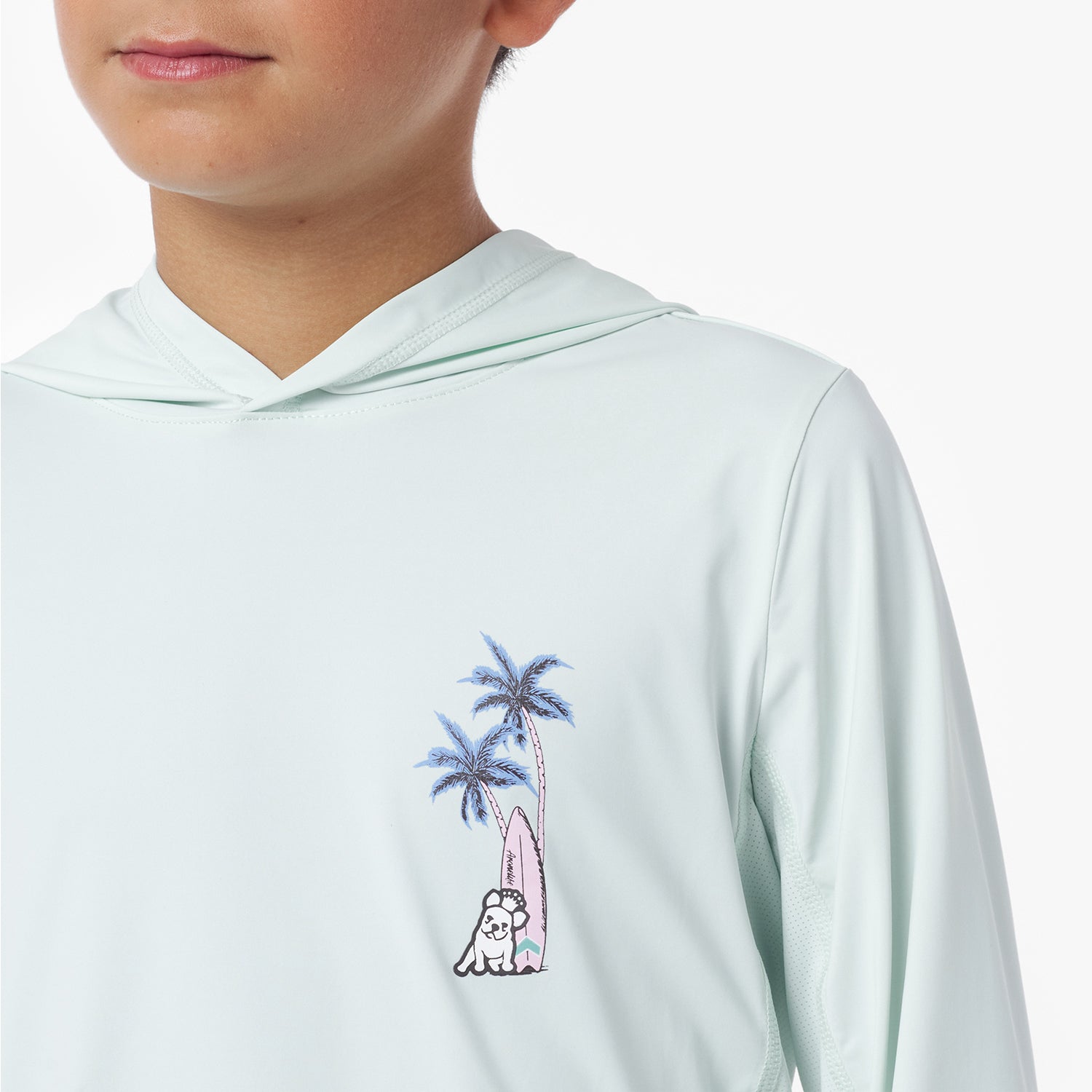 Close-up of a light blue rashguard with palm tree and surfboard design
