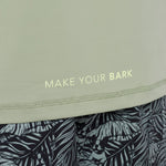 Text 'MAKE YOUR BARK' on a light green rashguard