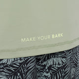 Text 'MAKE YOUR BARK' on a light green rashguard