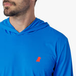 Close-up of a blue rashguard with a red logo