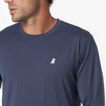Close-up of a navy long-sleeve rashguard with a small white logo