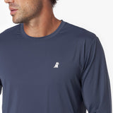 Close-up of a navy long-sleeve rashguard with a small white logo