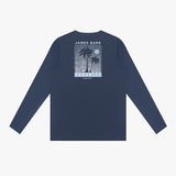 Back view of a navy blue rashguard with palm tree design and text on a white background