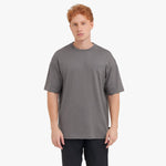 Man wearing a gray t-shirt on a white background