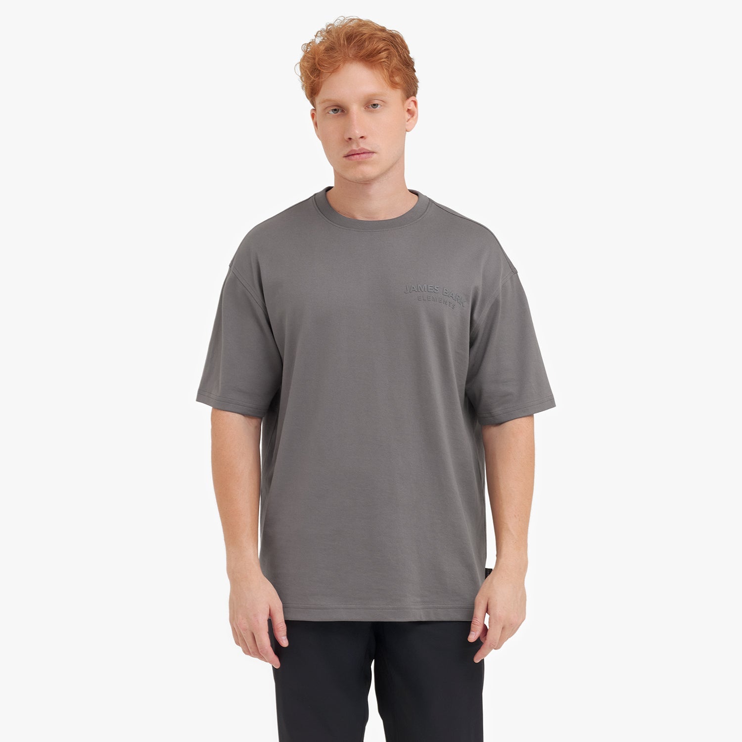 Man wearing a gray t-shirt on a white background