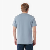 Back picture of a man wearing a light blue t-shirt on a white background
