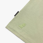Close-up of a green fabric with a logo on a white background