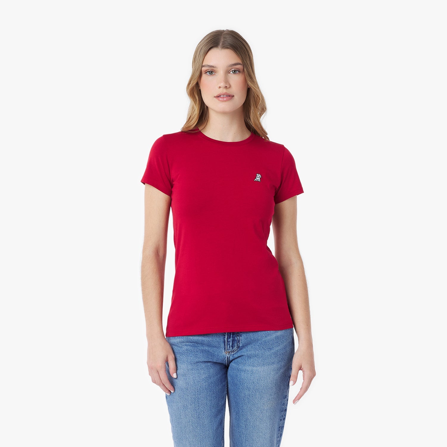 Woman wearing a red t-shirt with a small logo on a white background