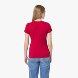 Back view of a woman wearing a red t-shirt and blue jeans on a white background