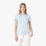 Woman wearing a light blue t-shirt on a white background