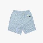 Back view of the blue and white striped swim trunks, showing the elastic waistband and a back pocket with a neon yellow accent