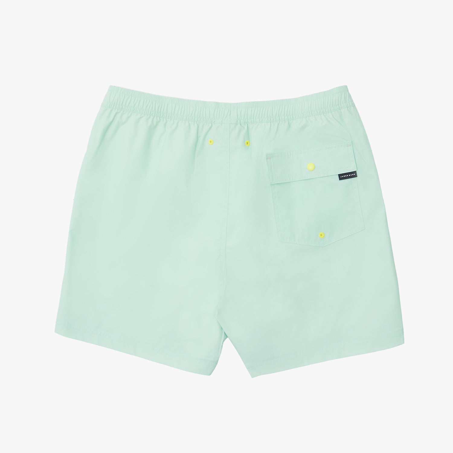 Back of the light green shorts with a small logo on a white background