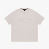 Beige t-shirt with 'JAMES BARK ELEMENTS' text on a white background