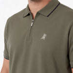 Close-up of a Mens Travel Polo in color Beetle dark green with an embroidered green dog logo