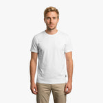Man wearing a plain white t-shirt on a white background