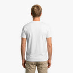Back view of a man wearing a plain white t-shirt on a white background