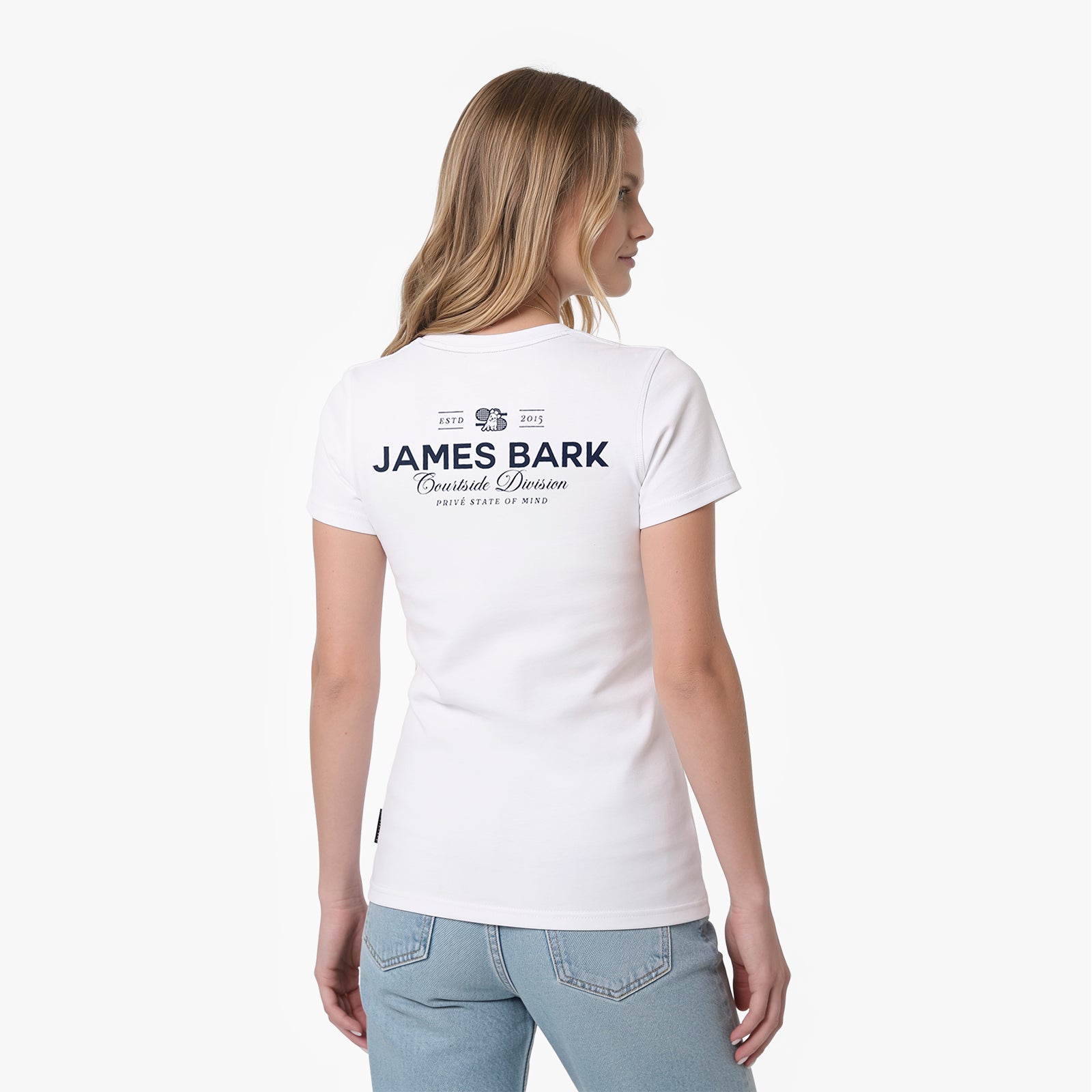 A woman shown from the back wearing a white T-shirt with a dark navy James Bark graphic on the upper back