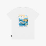 A white T-shirt with a colorful graphic print featuring a yacht, a coastal castle, and the text 'JAMES BARK Yacht Club' and 'LUXURY BY THE COAST'.