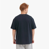 Back view of a man wearing a dark blue t-shirt on a white background