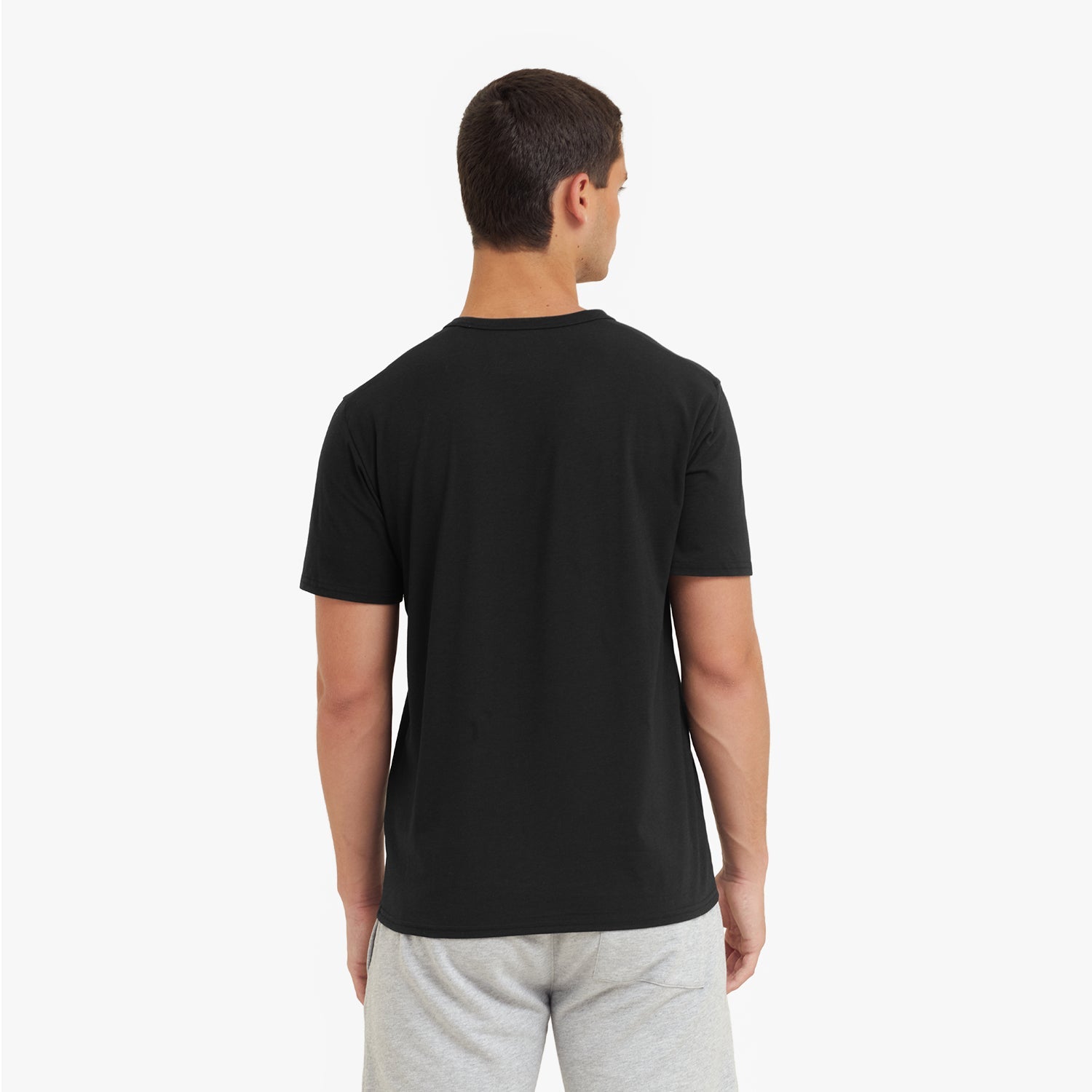 Man wearing a black t-shirt on a white background