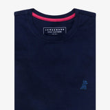 Flat-lay view of a navy blue t-shirt showing the neckline with the inner label and pink detailing.
